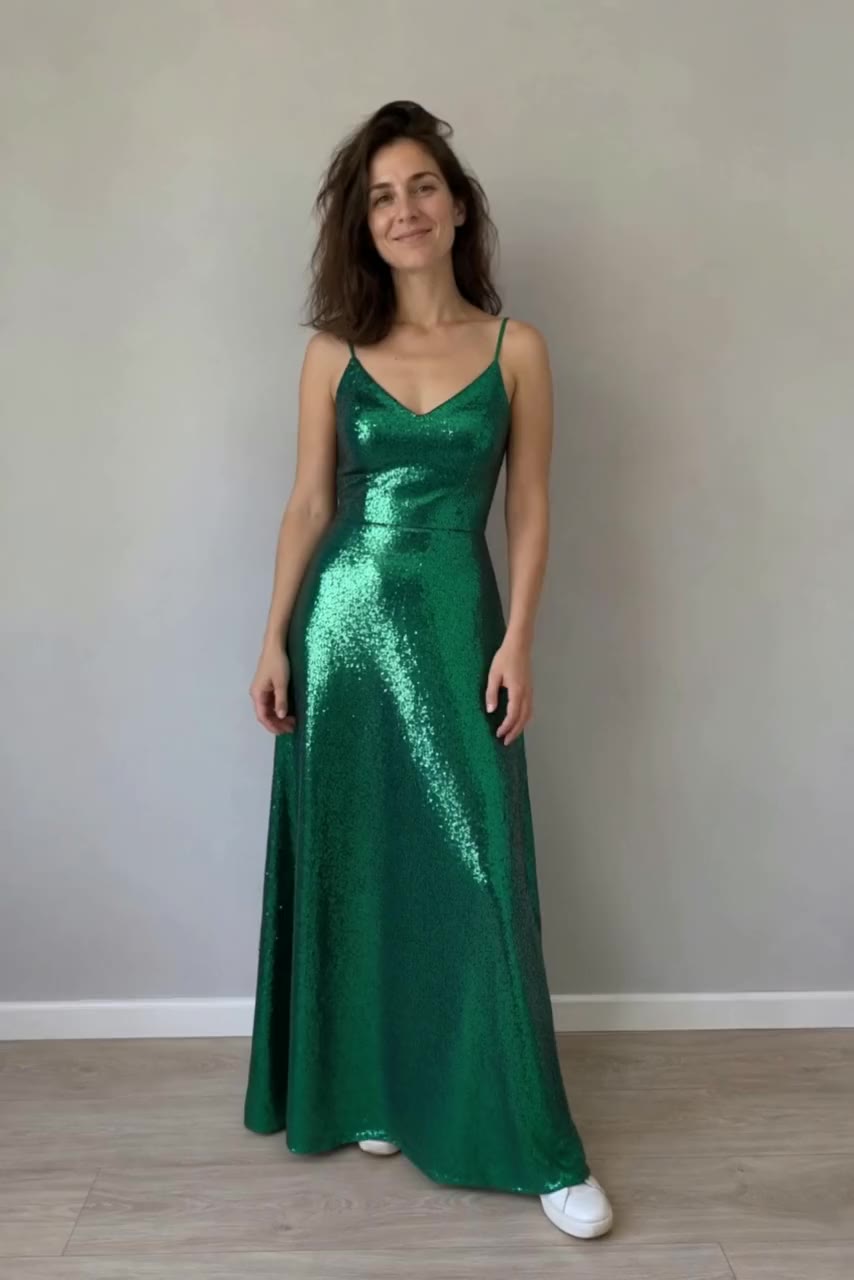 Actual Aisma result: The same turn in a floor-length emerald sequin gown.
