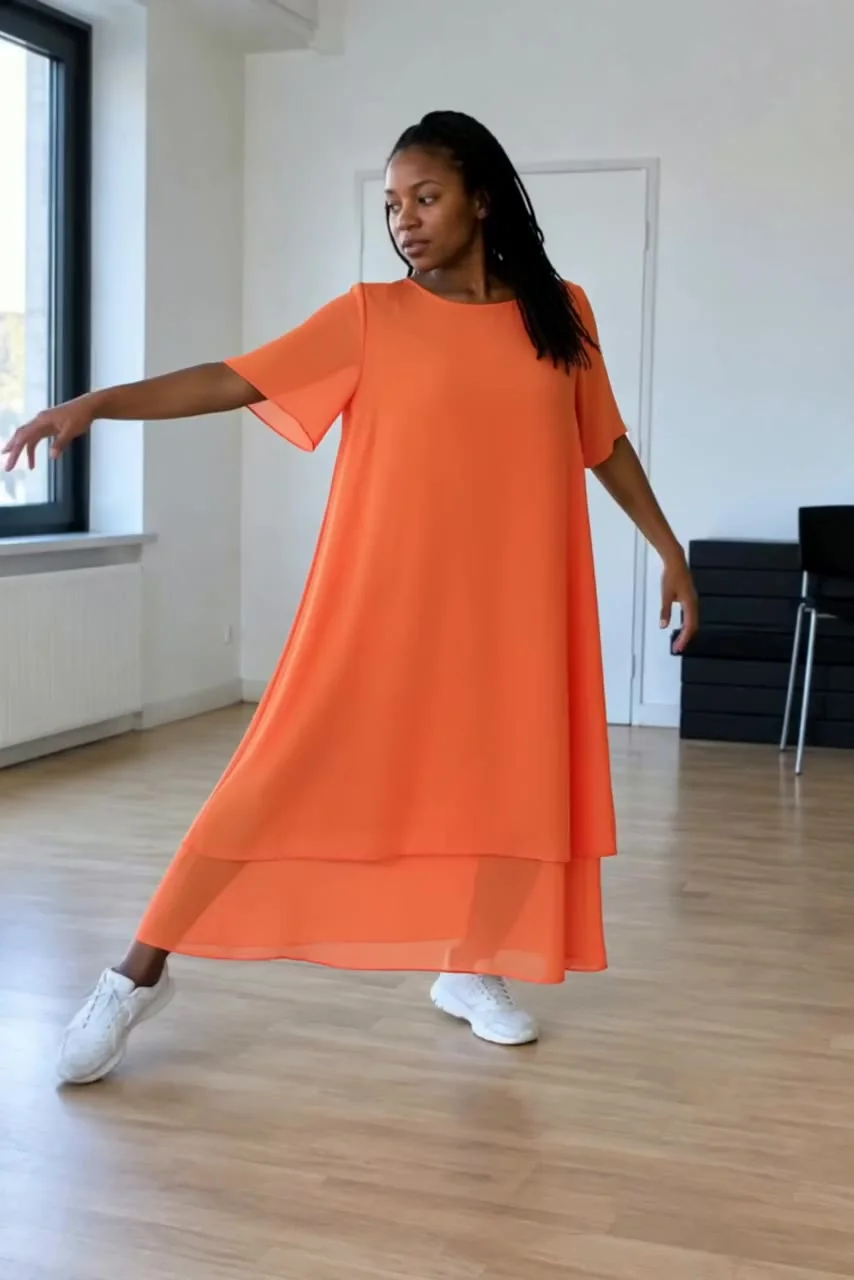 Actual Aisma result: The same dance step in a flame-orange chiffon dress.